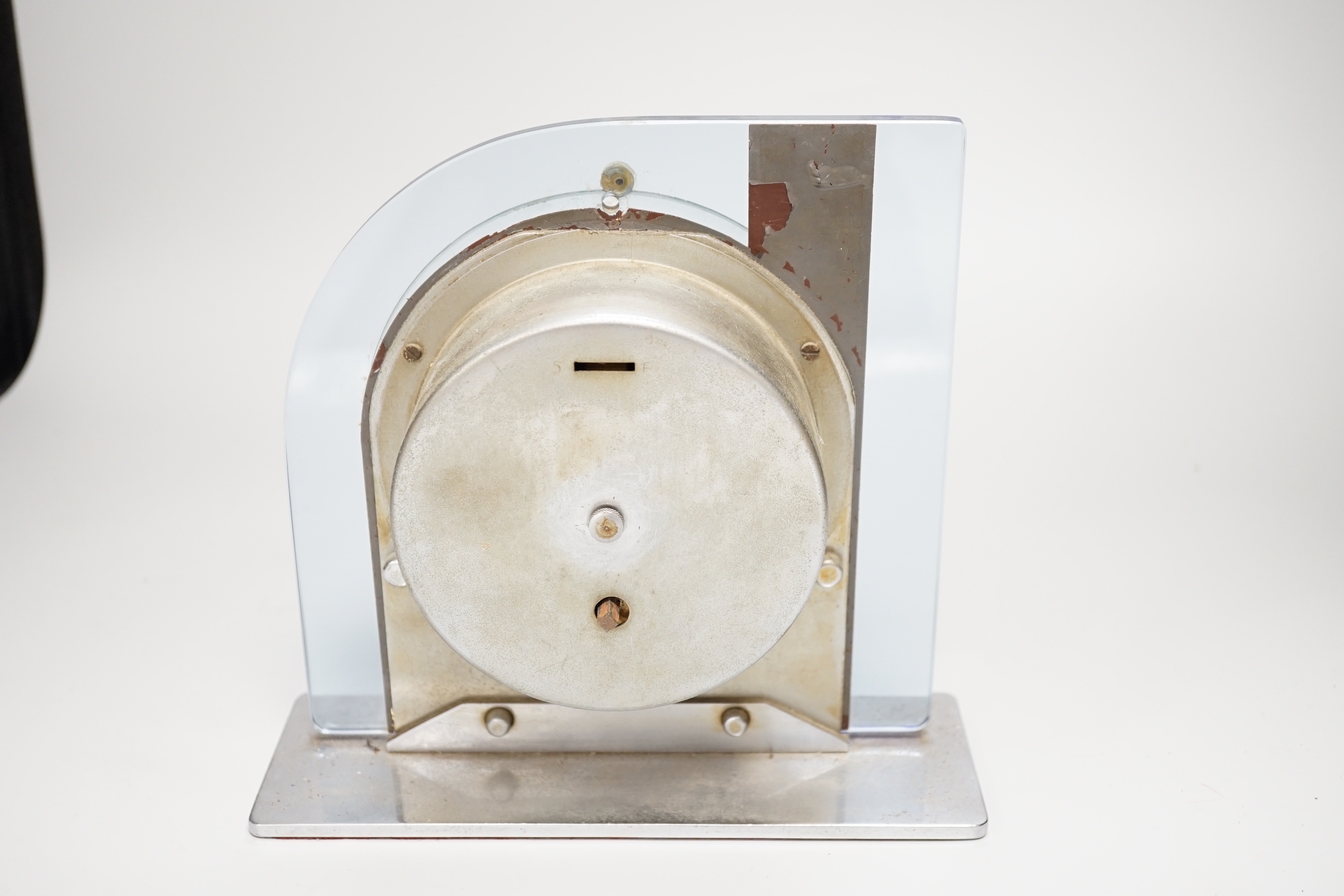 An Art Deco chrome and decorative glass mantel clock, 21cm high
